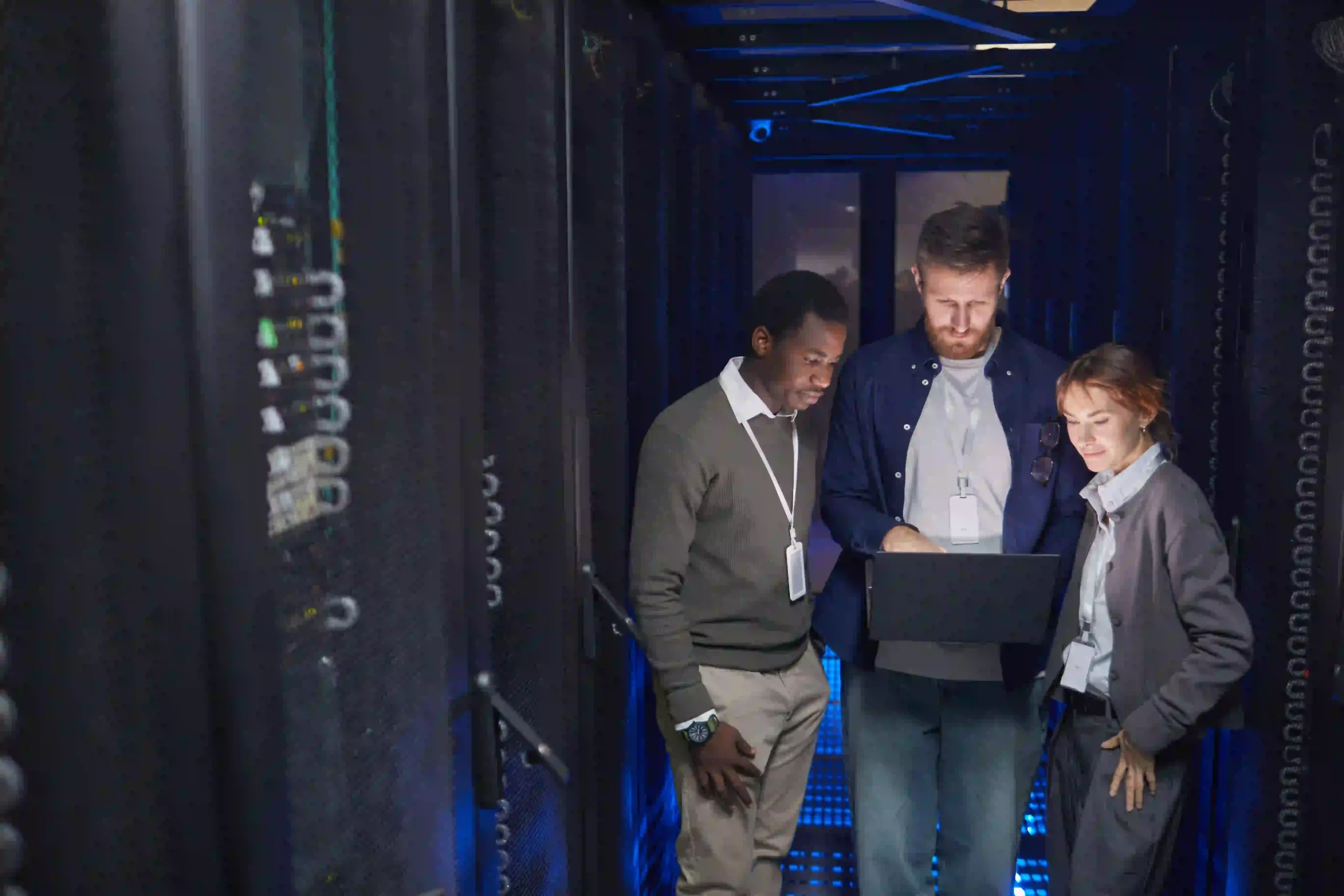 Server administration setup with IT professional monitoring system performance and managing enterprise servers.